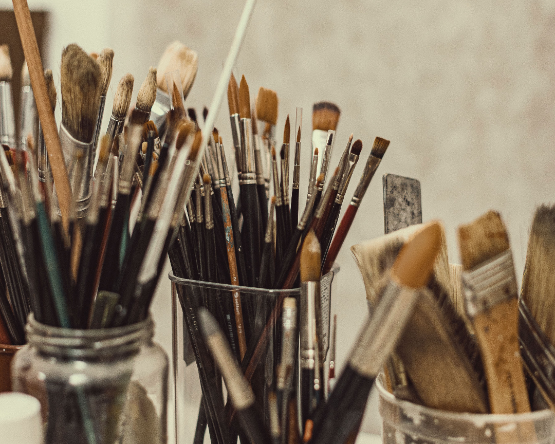 Cups of paint brushes